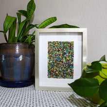 Load image into Gallery viewer, Framed abstract artwork on a table with plants
