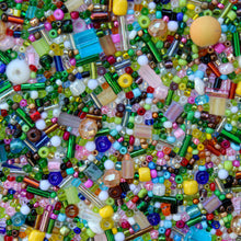 Load image into Gallery viewer, Assorted colorful beads scattered on a surface
