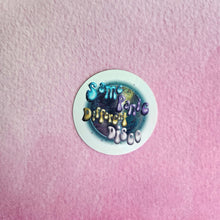 Load image into Gallery viewer, Round sticker with text 'Some People Prefer a Different Disco' on a pink textured background
