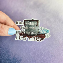 Load image into Gallery viewer, Sticker with text held by a hand against a purple background
