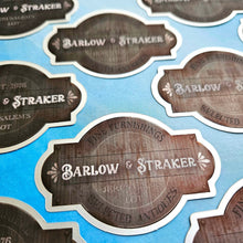 Load image into Gallery viewer, Collection of Barlow &amp; Straker branded labels on a blue background
