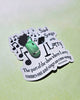 Sticker with 'Sad Songs with Larry' design on a light green background
