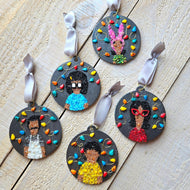 A set of five handmade Christmas ornaments featuring characters from the Bob's Burgers series. Each ornament has a dark gray base decorated with colorful beads and polymer clay accents.